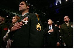 During an event honoring members of the U.S. military, President George W. Bush stands with U.S. Marine Corps Capt. Brian R. Chontosh, right, at the MCI Center in Washington, D.C., Tuesday, Jan. 18, 2005.  White House photo by Eric Draper