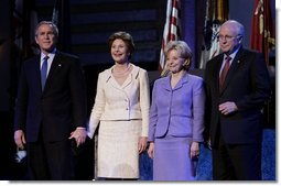 President George W. Bush stands with Laura Bush, Lynne Cheney and Vice President Dick Cheney during the pre-inaugural event “Saluting Those Who Serve” at the MCI Center in Washington, D.C., Tuesday Jan. 18, 2005.  White House photo by Eric Draper