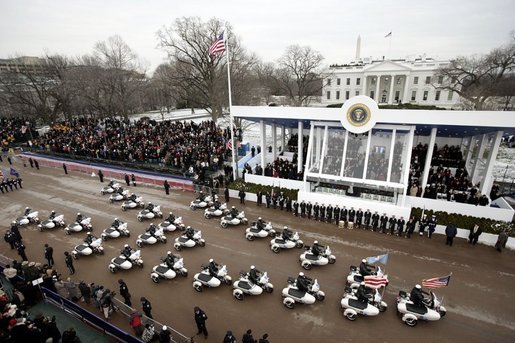 A procession of motorcycles leads the Inaugural Parade down Pennsylvania Avenue past the President's reviewing stand in front of the White House, Jan. 20, 2005. President George W. Bush and Laura Bush traveled with the parade after a swearing-in ceremony for the President at the U.S. Capitol. White House photo by Paul Morse