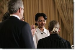 As President George W. Bush watches, Justice Ruth Bader Ginsburg ceremoniously swears in Dr. Condoleezza Rice Friday, Jan. 28, 2005, as Secretary of State. Secretary Rice officially was sworn in Wednesday after her 85-13 Senate confirmation.  White House photo by Eric Draper