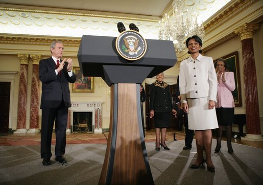 President George W. Bush leads the applause Friday, Jan. 28, 2005, after introducing Dr. Condoleezza Rice as the new Secretary of State during her ceremonial swearing in at the U.S. Department of State. White House photo by Eric Draper