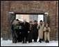 Vice President Dick Cheney and his daughter Liz Cheney, left, walk with other members of a U.S. delegation before paying respects at The Wall of Death at the Auschwitz-1 Nazi concentration camp, near Krakow, Poland, Jan. 28, 2005. Vice President Cheney was there to take part in ceremonies commemorating the 60th Anniversary of the liberation of the Auschwitz camps. The Wall of Death was named for its use as the backdrop for firing squads where thousands of prisoners were executed while the camp was in operation. White House photo by David Bohrer