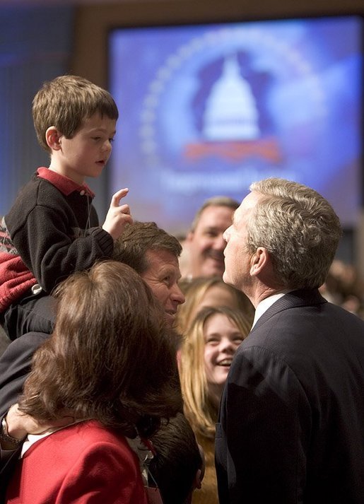 President George W. Bush talks with a young boy prior to delivering remarks on his legislative priorities and initiatives for the 109th Congressional session of Congress during a retreat in White Sulphur Springs, W.V., Friday, Jan. 28, 2005. White House photo by Paul Morse