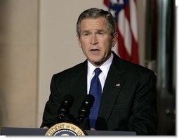 President George W. Bush delivers a live televised statement on Iraq's elections from the Cross Hall of the White House, Sunday, Jan. 30, 2005.  White House photo by Eric Draper