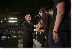 President George W. Bush greets audience members after holding a conversation about the strengthening of Social Security at ExpoPark in Great Falls, Mont., Feb., 3, 2005. "I believe you ought to be able -- allowed to take some of your own money, payroll taxes, and set up a personal retirement account, on a voluntary basis," said the President in his remarks.  White House photo by Eric Draper