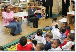 Laura Bush joins pre-school teacher Georgianna Ragland's class in a song during her visit to the Germantown Boys and Girls Club Tuesday, Feb. 3, 2005 in Philadelphia. Mrs Bush highlighted the importance of programs that support youth, especially at-risk boys.  White House photo by Susan Sterner