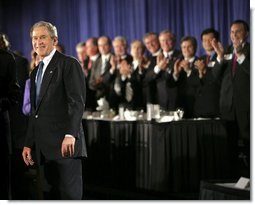 President George W. Bush receives applause during his introduction at the Detroit Economic Club in Detroit, Michigan, Tuesday, Feb. 8, 2005.   White House photo by Eric Draper