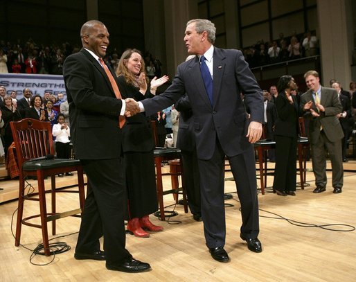 President George W. Bush greets his fellow stage participants during a Town Hall meeting on strengthening Social Security in Raleigh, N.C., Thursday, Feb. 10, 2005. White House photo by Eric Draper