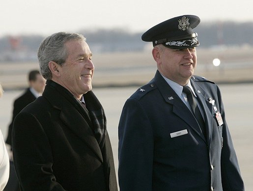 Brigadier General George A. Gray III escorts President George W. Bush to Air Force One at Andrews Air Force Base, Sunday, Feb. 20, 2005. President Bush and Laura Bush traveled to Brussels today, kicking off a five-day trip to Belgium, Germany, and Slovakia. White House photo by Eric Draper