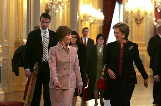 Laura Bush walks with Queen Paola of Belgium during a tour of the Royal Palace of Belgium in Brussels Monday, Feb. 21, 2005. White House photo by Susan Sterner