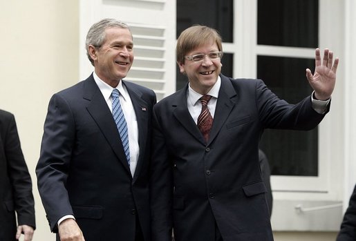 President George W. Bush and Belgian Prime Minister Guy Verhofstadt wave to the press outside the Prime Minister's office in Brussels, Belgium, Feb. 21, 2005. White House photo by Paul Morse.