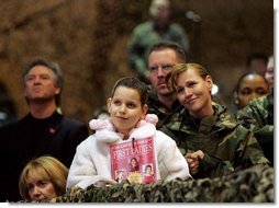 Audience members listen to a speech by Laura Bush praising the sacrifice and hard work of the U.S. military and their families Tuesday, Feb. 22, 2005 at Ramstein Air Base in Ramstein, Germany.  White House photo by Susan Sterner