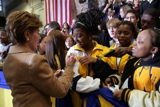 Laura Bush signs autographs for students of General H. H. Arnold High School following her remarks there to students, faculty and parents of the military in Wiesbaden, Germany, Tuesday, Feb. 22, 2005. White House photo by Susan Sterner