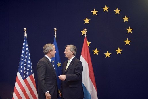 President George W. Bush meets with European Union President Jean-Claude Juncker while at the NATO Summit in Brussels Tuesday, Feb. 22, 2005. White House photo by Paul Morse