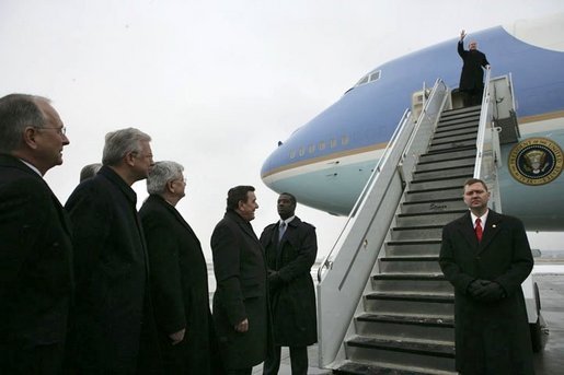German Chancellor Gerhard Schroeder, fourth from left, and others wait on the tarmac as arriving U.S. President George W. Bush deplanes Air Force One at Rhein-Main Air Base in Frankfurt, Germany. White House photo by Eric Draper