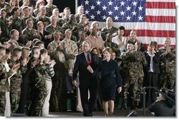 During a Feb. 23, 2005, visit to Wiesbaden Army Air Field in Wiesbaden, Germany, President George W. Bush and Laura Bush are welcomed by applause from U.S. troops.   White House photo by Paul Morse