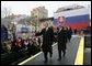 President George W. Bush gives his thumbs up as he leaves the stage with Prime Minister Mikulas Dzurinda of Slovakia after speaking at Hviezdoslavovo Square in Bratislava, Slovakia, Thursday, Feb. 24, 2005. White House photo by Eric Draper