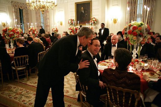 President George W. Bush talks with Governor Bob Taft, R-Ohio, during a state dinner for the National Governors Association at the White House Sunday, Feb. 27, 2005. White House photo by Paul Morse