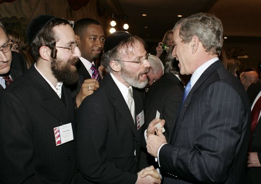 President George W. Bush greets attendees during a White House Faith-Based and Community Initiatives Leadership Conference in Washington, D.C., Tuesday, March 1, 2005. White House photo by Paul Morse