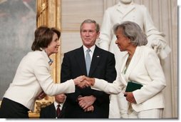 Congressional Minority Leader Nancy Pelosi congratulates Rachel Robinson, widow of Jackie Robinson, during a Congressional Gold Medal ceremony honoring Jackie Robinson at the U.S. Capitol, Wednesday, March 2, 2005. Jackie Robinson became the first black player in Major League Baseball when he signed with the Brooklyn Dodgers in 1947.  White House photo by Eric Draper