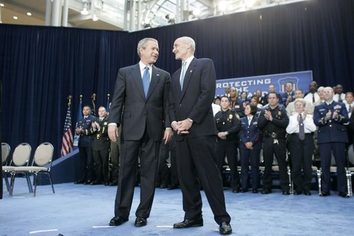 President George W. Bush stands with new U.S. Secretary of Homeland Security Michael Chertoff during Chertoff’s swearing-in ceremony Thursday, Mar. 3, 2005, at the Ronald Reagan Building and International Trade Center in Washington, D.C. White House photo by Paul Morse