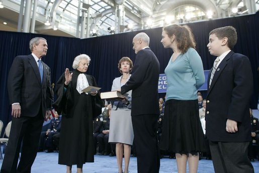 President George W. Bush watches as U.S. Supreme Court Justice Sandra Day O’Connor swears in Michael Chertoff as Secretary of Homeland Security during a ceremony Thursday, Mar. 3, 2005, at the Ronald Reagan Building and International Trade Center in Washington, D.C. On stage with Mr. Chertoff is his wife Meryl, center, and their two children Philip and Emily. White House photo by Paul Morse