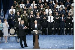 President George W. Bush and guests applaud Secretary Michael Chertoff after he was sworn in as the second Secretary of Homeland Security Thursday. Mar. 3, 2005.   White House photo by Paul Morse