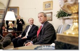President George W. Bush and Romanian President Traian Basescu take questions from the media in the Oval Office Wednesday, March 9, 2005.  White House photo by Paul Morse