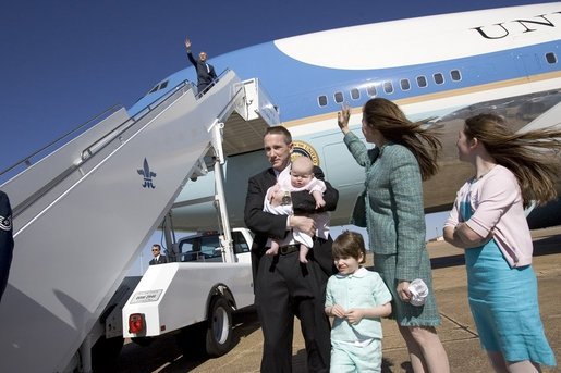 President George W. Bush waves from Air Force One during a visit to Shreveport, La., Friday, March 11, 2005. White House photo by Paul Morse