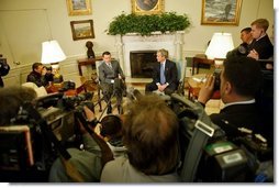President George W. Bush and His Majesty King Abdullah of Jordan meet with reporters in the Oval Office Tuesday, March 15, 2004.  White House photo by Paul Morse