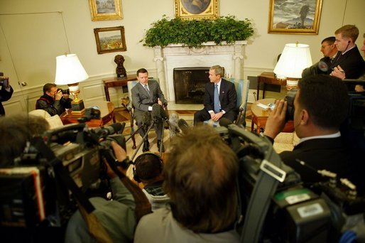 President George W. Bush and His Majesty King Abdullah of Jordan meet with reporters in the Oval Office Tuesday, March 15, 2004. White House photo by Paul Morse