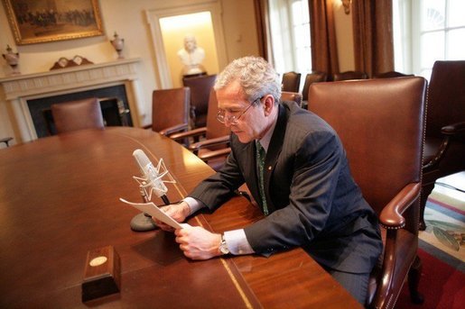 President George W. Bush records his radio address for a Saturday morning broadcast in the Cabinet Room of the White House Thursday, March 17, 2005. White House photo by Eric Draper