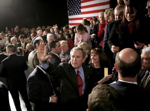 President George W. Bush waves to the crowd at the end of his ‘Conversation on Strengthening Social Security’ Monday, March 21, 2005, in Denver. The President took his plans for reform to an estimated 1,200 guests at the Wings Over the Rockies Air and Space Museum. White House photo by Eric Draper