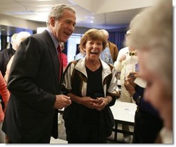 President George W. Bush shares a light moment with seniors at Tucson’s Morris K. Udall Center during his early morning visit Monday, March 21, 2005. The president made the recreational center his first Arizona stop and spoke to seniors there about his plans for strengthening Social Security.  White House photo by Eric Draper