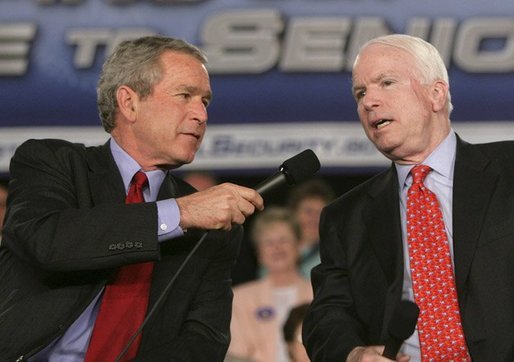 President George W. Bush shares the microphone with Senator John McCain, R-Ariz., as they speak to an audience at the Tucson Convention Center Monday, March 21, 2005, about strengthening Social Security. White House photo by Eric Draper