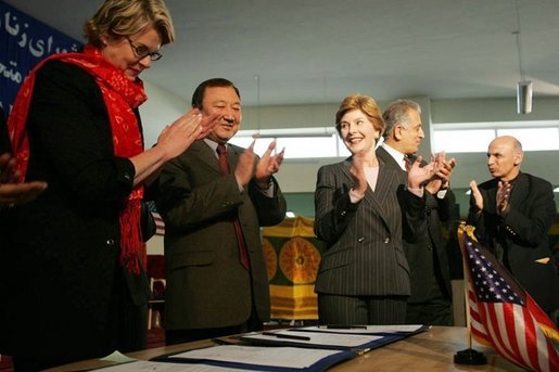Laura Bush applauds as Secretary of Education Margaret Spellings and Afghan Minister of Education Noor Mohammas Qarqeen complete the signing of the Memorandum of Understanding for funds to build a university in Kabul, Afghanistan Wednesday, March 30, 2005. White House photo by Susan Sterner