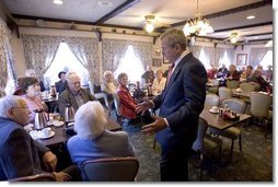 President George W. Bush talks with senior citizens at the Spring House Family Restaurant in Cedar Rapids, Iowa, March 30, 2005.  White House photo by Paul Morse
