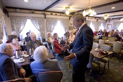 President George W. Bush talks with senior citizens at the Spring House Family Restaurant in Cedar Rapids, Iowa, March 30, 2005. White House photo by Paul Morse