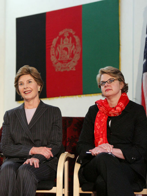 Laura Bush and U.S. Secretary of Education Margaret Spellings are seated together onstage at Kabul University Wednesday, March 30, 2005 in Kabul, Afghanistan. Mrs. Bush and Secretary Spellings toured the Women’s Teacher’s Training Institute and the National Women’s Dormitory prior to Mrs. Bush's announcement of the United States' commitment to provide more than 15 million dollars in funds for building a new university in Kabul. White House photo by Susan Sterner