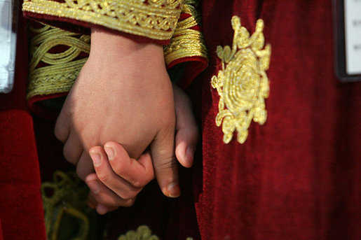 Children from the School of Hope hold hands during a visit by Laura Bush to Kabul University in Kabul, Afghanistan, Wednesday, March 30, 2005. White House photo by Susan Sterner