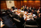 President George W. Bush meets with members of his national security team Thursday, March 31, 2005, at the White House to discuss the findings of the Commission on the Intelligence Capablities of the United States regarding Weapons of Mass Destruction. The 13-chapter report to the President was released Thursday. White House photo by Eric Draper