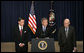 President George W. Bush, flanked by former Senator Chuck Robb, D-Va., left, and Judge Laurence Silberman, delivers a statement regarding the release Thursday, March 31, 2005, of findings by the Commission on the Intelligence Capabilities of the United States Regarding Weapons of Mass Destruction. Senator Robb and Judge Silberman are co-chairs of the commission that was established in 2004. White House photo by Eric Draper