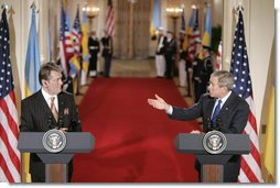 President George W. Bush gestures to Ukraine President Viktor Yushchenko Monday, April 4, 2005, during a press availability at the White House. White House photo by Paul Morse