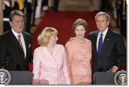 President George W. Bush and Ukraine President Viktor Yushchenko are joined at the podiums by first ladies Laura Bush and Kateryna Yushchenko Monday, April 4, 2005, in the East Room of the White House. White House photo by Paul Morse