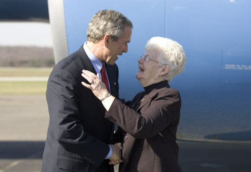 President George W. Bush greets volunteer June Roberts of Slate, W.Va. outside Air Force One Tuesday April 5, 2005. Mrs. Roberts, 72, founded Senior Stitchers, a program in which seniors create sewing and craft projects for local child-services agencies, senior centers, and hospitals. White House photo by Paul Morse