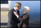 President George W. Bush greets volunteer June Roberts of Slate, W.Va. outside Air Force One Tuesday April 5, 2005. Mrs. Roberts, 72, founded Senior Stitchers, a program in which seniors create sewing and craft projects for local child-services agencies, senior centers, and hospitals. White House photo by Paul Morse