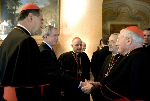 President George W. Bush greets U.S.-based Roman Catholic Cardinals during a reception Thursday, April 7, 2005, in Rome at Villa Taverna, the residence of the Mel Sembler, U.S. Ambassador to Italy. From left are: Roger Cardinal Mahony, archbishop of Los Angeles; President Bush; Francis Cardinal George, archbishop of Chicago; Justin Cardinal Rigali, archbishop of Philadelphia, and William Cardinal Keeler, archbishop of Baltimore. White House photo by Eric Draper