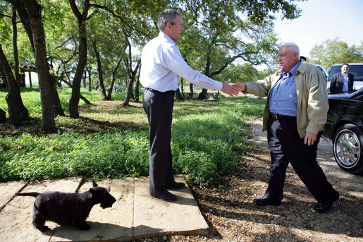Israeli Prime Minister Ariel Sharon is greeted by President George W. Bush upon the Prime Minister's arrival Monday, April 11, 2005, to the President's ranch in Crawford, Texas.White House photo by Eric Draper