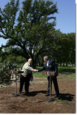 Israeli Prime Minister Ariel Sharon and President George W. Bush shake hands during a press conference at the President's Ranch in Crawford, Texas, Monday, April 11, 2005. White House photo by David Bohrer
