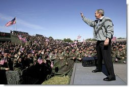President George W. Bush waves to the troops at Fort Hood, Texas, as he arrived Tuesday, April 12, 2005, to thank them in person for their service in Iraq. "Americans are grateful for your sacrifice and your service," the President told a large portion of the 44,188 soldiers and airmen stationed at the base. ".And so is your Commander-in-Chief."  White House photo by Eric Draper